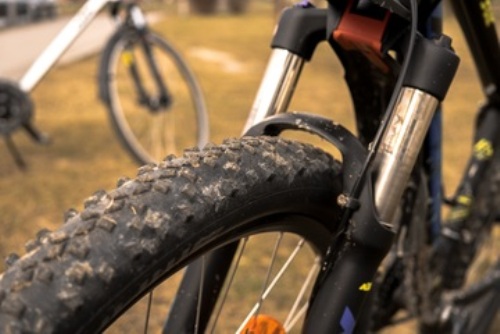 close up of mountain bike with road tires